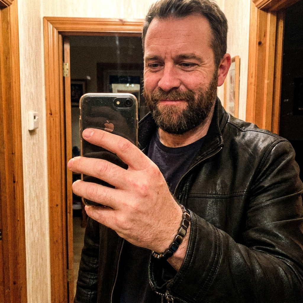 Ryan J. wearing the Hematite Band on his wrist with a leather jacket